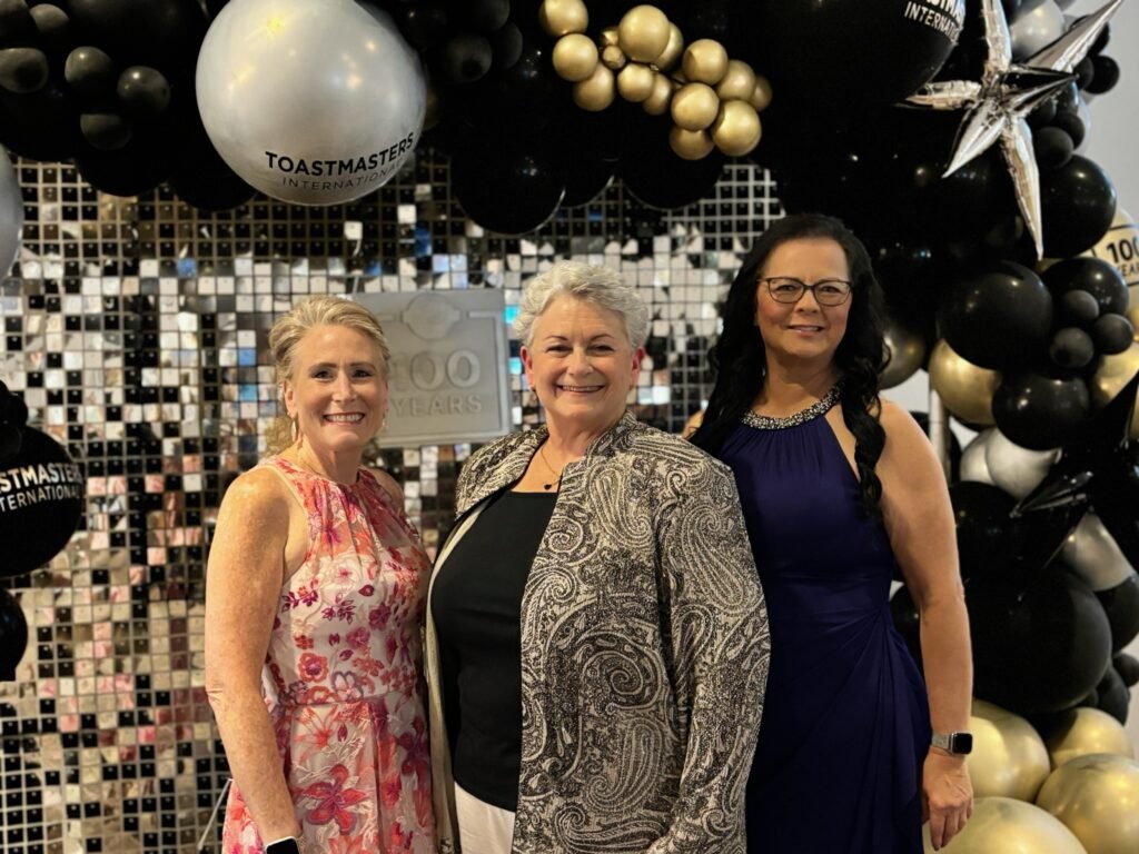 3 women surrounded by balloons